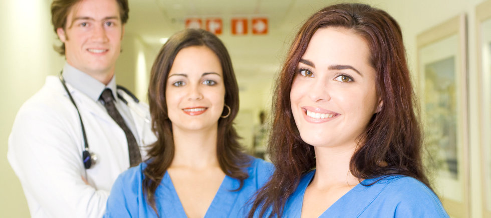nurses and doctor smiling